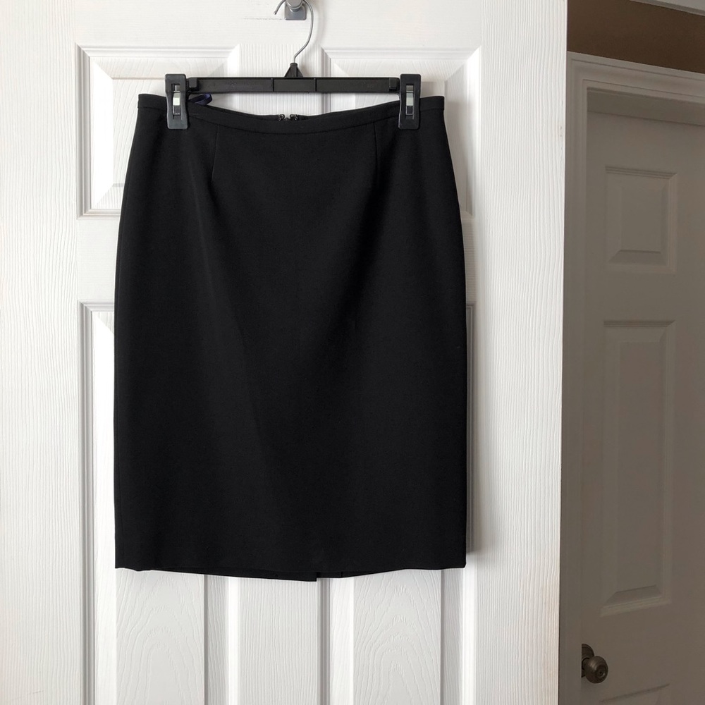 Black knee length skirt.